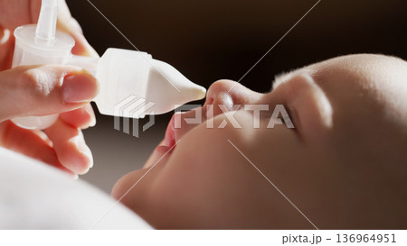 Mom Cleaning Baby Nose With Nasal Blower, Aspirator Cleaner. Mucus Snot Suction  136964951