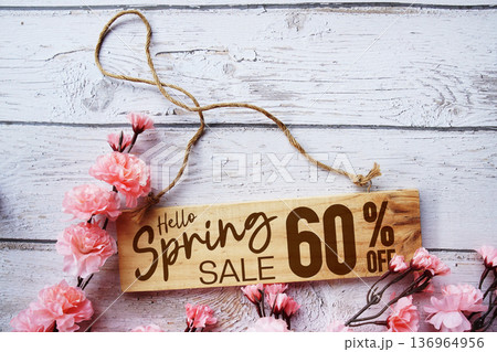 Spring Sale 60% off with flower bouquet decoration on wooden background 136964956
