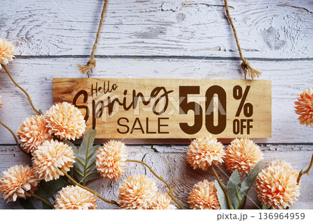 Spring Sale 50% off with flower bouquet decoration on wooden background 136964959