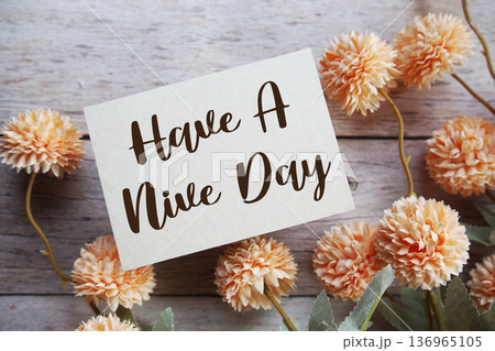 Have A Nice Day Motivational and Inspirational quotes with flowers bouquet decoration on wooen background 136965105