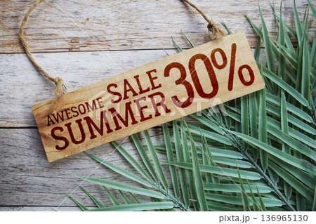Awesome Summer Sale 30% off with green leaf on wooden background 136965130