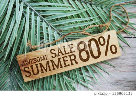 Awesome Summer Sale 80% off with green leaf on wooden background 136965135