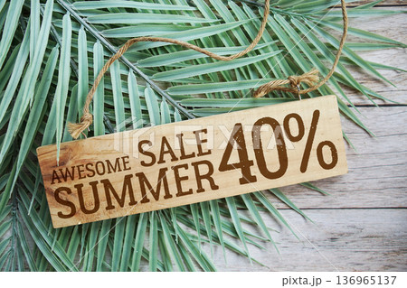 Awesome Summer Sale 40% off with green leaf on wooden background 136965137