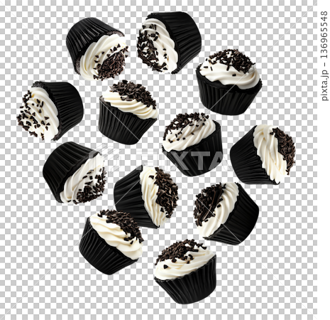 Chocolate cupcakes with vanilla frosting and chocolate isolated on white background, concept of dessert, sweets, and celebration 136965548