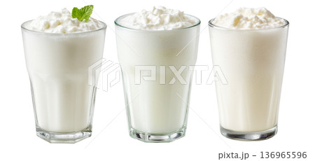 Ayran salted yogurt drink in tall glass with foamy top and mint leaf, isolated on white background, concept of healthy drink Ayran salted yogurt drink in tall glass with foamy top and mint leaf, isolated on white background, concept of healthy drink 136965596