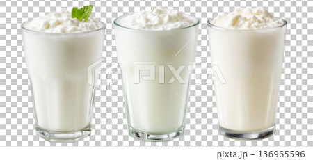 Ayran salted yogurt drink in tall glass with foamy top and mint leaf, isolated on white background, concept of healthy drink 136965596