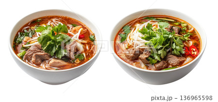 Vietnamese beef noodle soup Bun Bo Hue with herbs, lime slice, and rice noodles in broth isolated on white background Vietnamese beef noodle soup Bun Bo Hue with herbs, lime slice, and rice noodles in broth isolated on white background 136965598