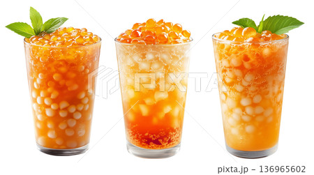 Orange bubble tea Filipino Sagot Gulaman filled with tapioca pearls and topped with mint, isolated on white background. Orange bubble tea Filipino Sagot Gulaman filled with tapioca pearls and topped with mint, isolated on white background. 136965602