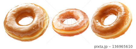 Tasty round donut topped with caramel and vanilla glaze swirl, isolated on white transparent background 136965610
