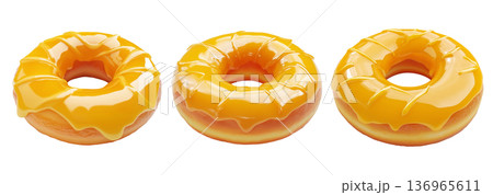 Delicious donut covered in shiny yellow glaze and decorative swirl topping, isolated on white transparent background 136965611
