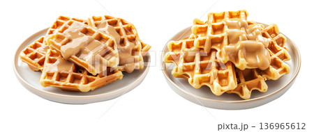 Waffles topped with creamy sauce served on white plate, isolated on white background, concept of sweet breakfast treat 136965612