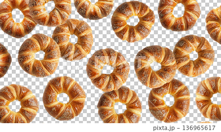 Multiple twisted pretzel buns or bagel with coarse salt topping arranged in seamless pattern isolated on white background 136965617
