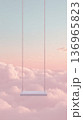 Empty swing above pastel clouds, invitation to daydream 136965823