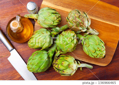 Bottle of vegetable oil and artichokes 136966465