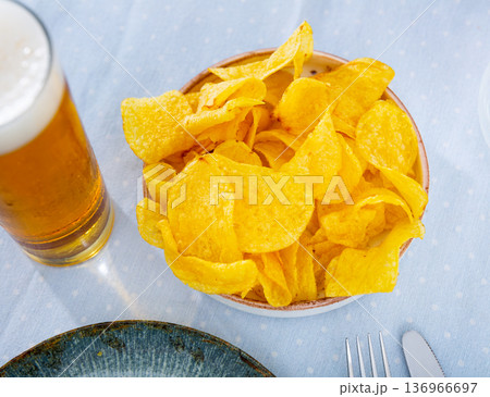 Appetizing chips with a glass of beer Appetizing chips with a glass of beer 136966697