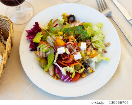 Mediterranean tuna salad with vegetables, olives, feta cheese and peach Mediterranean tuna salad with vegetables, olives, feta cheese and peach 136966705
