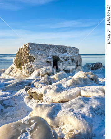 Frozen Coastal Fortification Ruins Covered in Ice on Baltic Sea Shore in Liepaja, Latvia 136967827