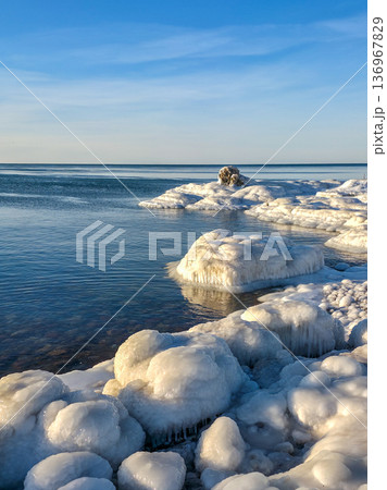 Winter Seascape with thick ice formations on the Baltic Sea Coast in Liepaja, Latvia Winter Seascape with thick ice formations on the Baltic Sea Coast in Liepaja, Latvia 136967829