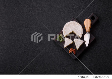 White French cream cheese Brie or Camembert for breakfast. Brie or Camembert cheese 136968699