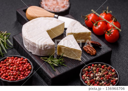White French cream cheese Brie or Camembert for breakfast. Brie or Camembert cheese White French cream cheese Brie or Camembert for breakfast. Brie or Camembert cheese 136968706