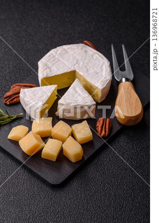 White French cream cheese Brie or Camembert for breakfast. Brie or Camembert cheese White French cream cheese Brie or Camembert for breakfast. Brie or Camembert cheese 136968721
