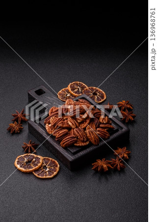 Peeled and roasted pecan nut as an ingredient for healthy food. Pecan nut as a food background Peeled and roasted pecan nut as an ingredient for healthy food. Pecan nut as a food background 136968761