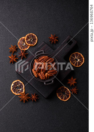 Peeled and roasted pecan nut as an ingredient for healthy food. Pecan nut as a food background Peeled and roasted pecan nut as an ingredient for healthy food. Pecan nut as a food background 136968764