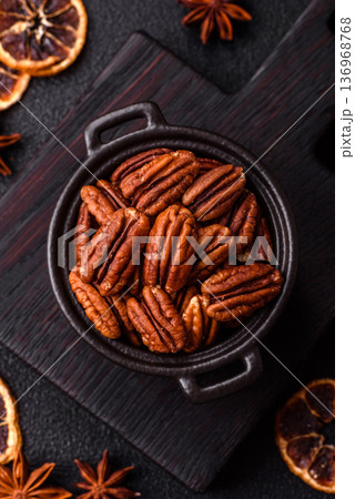 Peeled and roasted pecan nut as an ingredient for healthy food. Pecan nut as a food background Peeled and roasted pecan nut as an ingredient for healthy food. Pecan nut as a food background 136968768