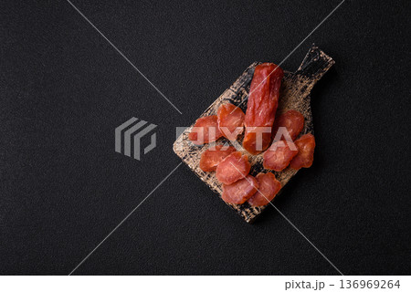 Sliced smoked dry sausage made from turkey or pork for sandwiches. Sliced smoked sausage Sliced smoked dry sausage made from turkey or pork for sandwiches. Sliced smoked sausage 136969264