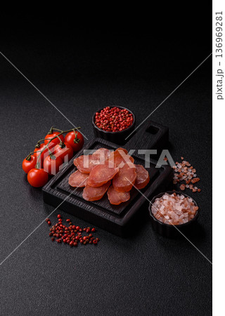 Sliced smoked dry sausage made from turkey or pork for sandwiches. Sliced smoked sausage 136969281
