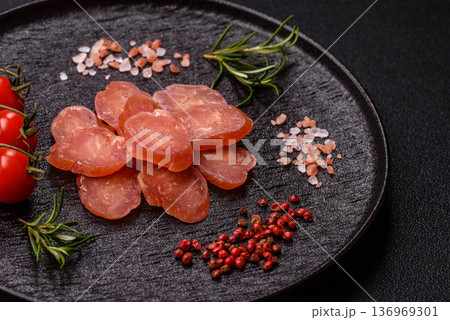 Sliced smoked dry sausage made from turkey or pork for sandwiches. Sliced smoked sausage 136969301