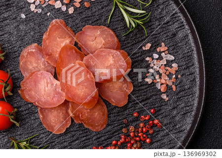 Sliced smoked dry sausage made from turkey or pork for sandwiches. Sliced smoked sausage 136969302