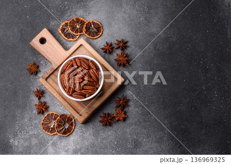 Peeled and roasted pecan nut as an ingredient for healthy food. Pecan nut as a food background Peeled and roasted pecan nut as an ingredient for healthy food. Pecan nut as a food background 136969325