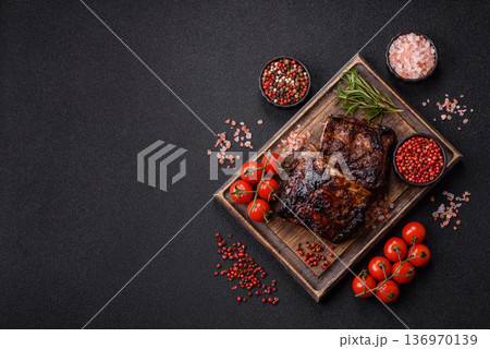 Grilled or barbecued pork or beef ribs, meat with red sauce for the dinner table. Grilled ribs 136970139