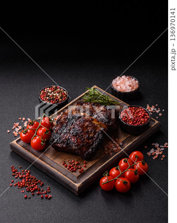 Grilled or barbecued pork or beef ribs, meat with red sauce for the dinner table. Grilled ribs Grilled or barbecued pork or beef ribs, meat with red sauce for the dinner table. Grilled ribs 136970141