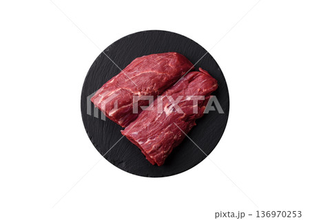 Raw meat, fresh beef tenderloin or filet mignon for grilling. Raw beef tenderloin Raw meat, fresh beef tenderloin or filet mignon for grilling. Raw beef tenderloin 136970253