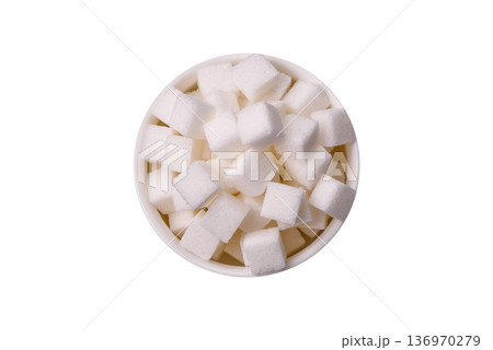 Sweet white sugar cubes as a source of glucose. White sugar cubes as a food background 136970279