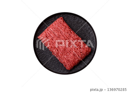 Raw ground beef or pork for burgers or meatballs with salt and spices. Raw ground beef Raw ground beef or pork for burgers or meatballs with salt and spices. Raw ground beef 136970285