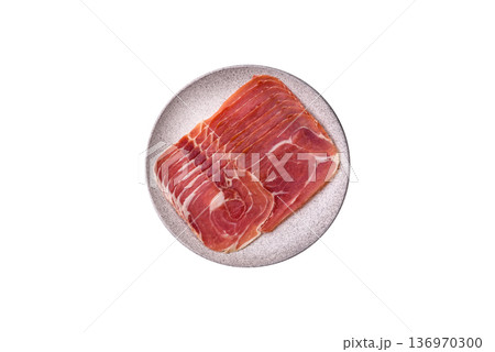 Meat, ham, jamon, or prosciutto sliced for breakfast bruschetta. Sliced ham, jamon, or prosciutto Meat, ham, jamon, or prosciutto sliced for breakfast bruschetta. Sliced ham, jamon, or prosciutto 136970300