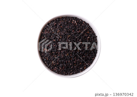 Black sesame seeds in a bowl, an ingredient for oil and healthy eating. Black sesame 136970342