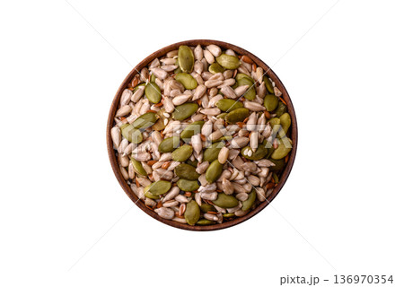 Shelled sunflower, sesame, pumpkin, and flaxseed kernels as ingredients for healthy food Shelled sunflower, sesame, pumpkin, and flaxseed kernels as ingredients for healthy food 136970354