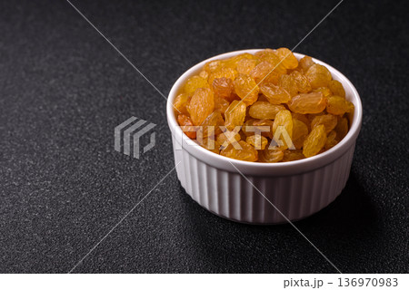 Sweet, dry, golden or yellow raisin made from grapes are a healthy, nutritious food. Golden raisins Sweet, dry, golden or yellow raisin made from grapes are a healthy, nutritious food. Golden raisins 136970983