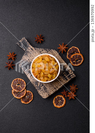 Sweet, dry, golden or yellow raisin made from grapes are a healthy, nutritious food. Golden raisins 136970992