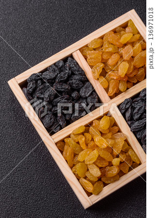 Sweet, dry, golden or yellow raisin made from grapes are a healthy, nutritious food. Golden raisins Sweet, dry, golden or yellow raisin made from grapes are a healthy, nutritious food. Golden raisins 136971018