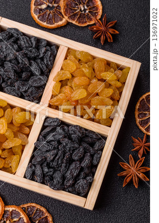 Sweet, dry, golden or yellow raisin made from grapes are a healthy, nutritious food. Golden raisins 136971022