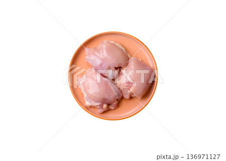 Chicken thigh fillet, skinless and boneless meat for grilling or barbecue. Chicken thigh fillet 136971127