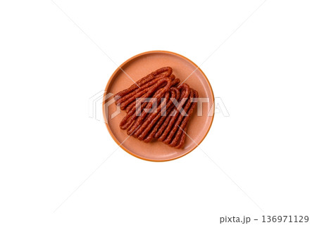 Smoked cabanossi, thin salami sausage, meat sticks, or snacks. Cabanossi sausage 136971129