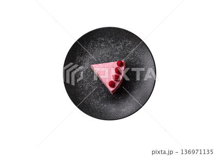 Raspberry or strawberry cheesecake, a slice of sweet red cake with berries. Raspberry cheesecake 136971135