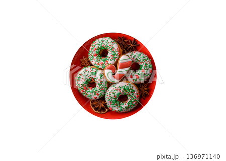 Christmas donuts or doughnuts, holiday winter sweets with sprinkles. Christmas donuts Christmas donuts or doughnuts, holiday winter sweets with sprinkles. Christmas donuts 136971140