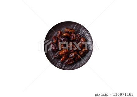 Dried sweet dates, natural tropical fruits for a healthy diet. Dried dates Dried sweet dates, natural tropical fruits for a healthy diet. Dried dates 136971163